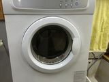 a washer and dryer in a small room