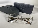 prada eyeglasses with case and box on white surface