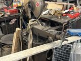 a picture of a workshop with a lot of clutter