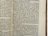 an open book with a black and white image of a man ' s face on it