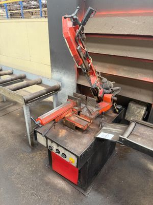 an image of a machine that is working on a piece of metal