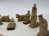 many figurines that are sitting on a white surface