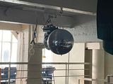 two disco balls hanging from the ceiling in a room