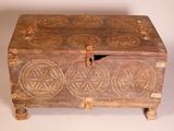 a wooden box that has a design on it