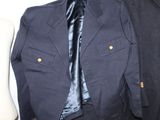 two jackets and a tie on a mannequin