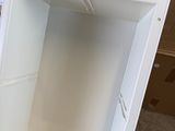 a white box that is sitting on the floor