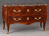 an antique chest of drawers with marble top
