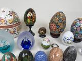 many different types of painted eggs on the table