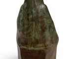 statue of a bird on a pedestal on a white background