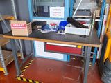a picture of a workbench with a lot of tools on it