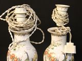 two vases that have been decorated with birds on them