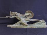 bronze statue of a woman with a spear and shield on a boat