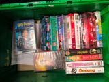 a green box full of movies and dvds