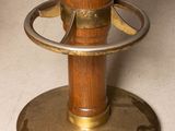 a close up of a wooden table with a metal base