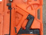 an orange tool box with tools in it sitting on the floor