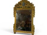 a mirror with a gold frame and a clock on it
