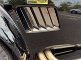 a close up of a car ' s bumper with a sticker on it
