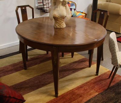 a table with a vase on top of it in a living room
