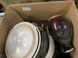 a box full of bowls and bowls sitting on a table