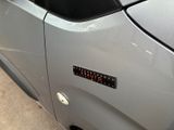 a close up of a car door with a sticker on it