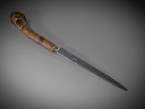 a knife that is laying on a table