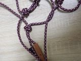 a pair of scissors and a rope on a table