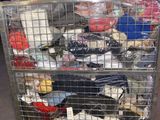 a metal cart with many items in it in a warehouse