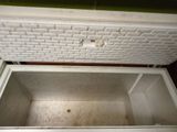 a white chest that is open on the floor