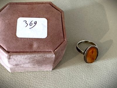a ring and a ring box on a table