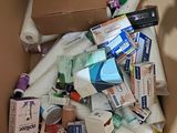 a cardboard box full of toilet paper and other items
