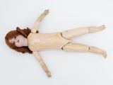 a doll that is laying down on the floor