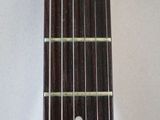 a close up of a guitar fret with a white background