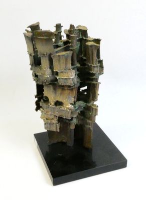 sculptures made of bronze on a black base on a white background
