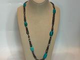 a close up of a mannequin with a necklace on it
