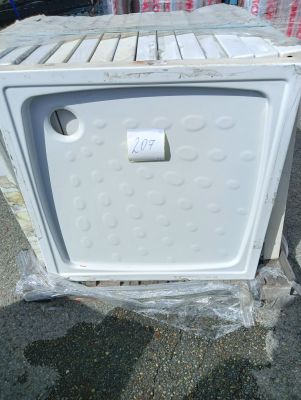 a white microwave sitting on top of a pallet
