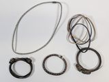 a lot of different rings and bracelets on the table