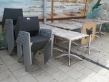 many chairs and tables in a room with a mural on the wall