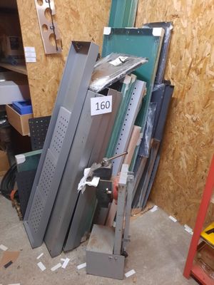 several pieces of metal are stacked up in a pile in a room