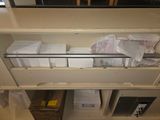many boxes and boxes on the shelves in the room