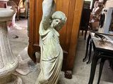 a statue of a boy holding a bird in his hand