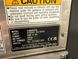 an image of a machine with a caution sign on it