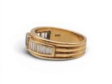 an image of a gold ring with baguets and diamonds