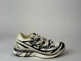 an image of a pair of white and black shoes on a white surface
