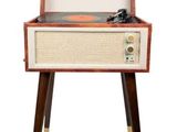 a record player sitting on top of a wooden table