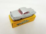 an image of a toy car sitting on top of a yellow box