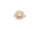 a white and yellow diamond ring with a center stone surrounded by small diamonds