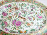 a plate with a floral design on it on a table