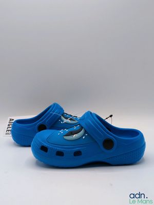 blue children ' s crocs with a shark design on the side