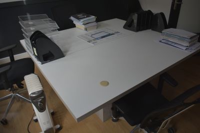 an image of a desk with a lot of papers on it