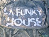 a plastic sign that says funky house on it